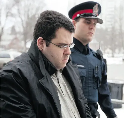  ?? GLENN LOWSON PHOTO FOR NATIONAL POST FILES ?? Trevor Lapierre is escorted into the Kitchener courthouse in 2010, when he pleaded guilty to the murder of Hunter Brown, 74, who was stabbed to death while out delivering Christmas cards.