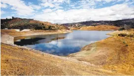  ?? PATRICK TEHAN/STAFF ?? A seismic retrofit project at Anderson Dam, which has raised public concerns because it will require the reservoir to be drained during constructi­on despite the drought, is behind schedule.