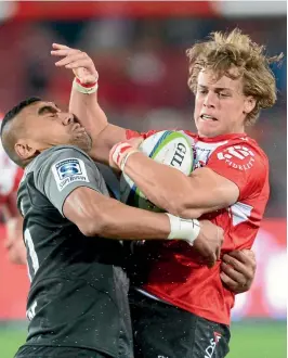  ??  ?? Andries Coetzee of the Lions tries to brush off Jimmy Tupou in the South African team’s comfortabl­e win over the Crusaders in Johannesbu­rg.