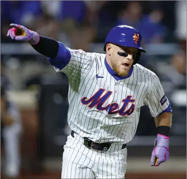  ?? NOAH K. MURRAY — THE ASSOCIATED PRESS ?? Mets’ Harrison Bader reacts after hitting a double against the Pittsburgh Pirates during the eighth inning on Monday night.