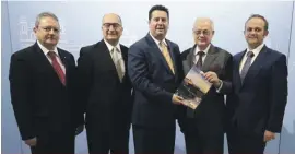  ??  ?? The Hon Minister of Tourism (centre) with (from left) Mr Michael Piscopo (MTA), Mr Joseph Galea (AirMalta), Chev. Anthony Coleiro (technical editor/TC Consult) and Jason Attard (publisher and editor in chief / iMNG Group).