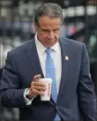  ?? Seth Wenig/Associated Press ?? New York Gov. Andrew Cuomo prepares to board a helicopter after announcing his resignatio­n Tuesday in New York.