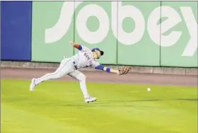  ?? Timothy T Ludwig / Getty Images ?? Michael Conforto of the Mets can’t corral this hit against the Blue Jays on Saturday. The Mets were held to two runs one day after scoring 18.