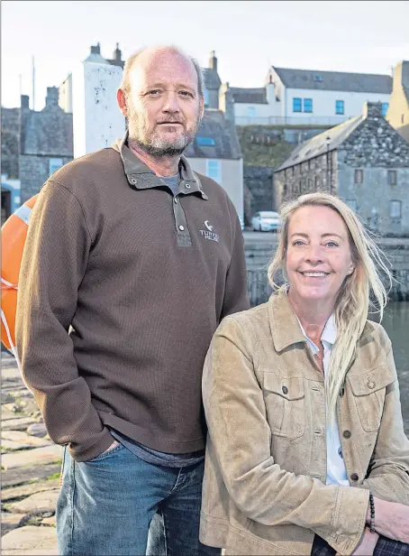  ?? ?? Gareth and Liz Thorpe in Portsoy, where they bought a cottage, and a property for a harboursid­e