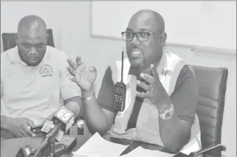  ??  ?? General Manager of the Demerara Harbour Bridge Corporatio­n Rawlston Adams (right) addressing the press conference. (DPI Photo)