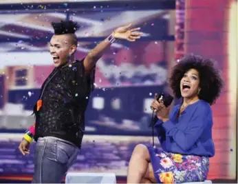  ?? SHAW MEDIA ?? Gary "Glitter" Levy makes a glittery exit from Big Brother Canada on the April 4 show, with host Arisa Cox.