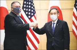 ?? Charly Triballeau Associated Press ?? U. S. SECRETARY of State Michael R. Pompeo meets with new Japanese Prime Minister Yoshihide Suga in Tokyo. Suga has vowed a hawkish security stance.