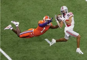  ?? The Associated Press ?? Ohio State wide receiver Chris Olave catches a touchdown pass in front of Clemson cornerback Derion Kendrick during the second half of the Sugar Bowl on Jan. 1 in New Orleans.