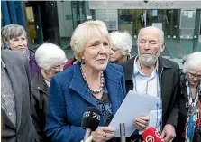  ?? KEVIN STENT/STUFF ?? Susan Austen leaves the High Court in Wellington with husband Mike Harris after being convicted of importing euthanasia drugs.