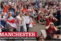  ?? ?? MANCHESTER Supporters watch match in Piccadilly Gardens