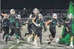  ?? NEWS-HERALD FILE ?? The Mayfield football team runs on to the field prior to a 2019 playoff game against South. The district announced it would resume athletics following an order from the Ohio Department of Health.