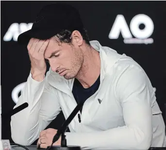  ?? KIN CHEUNG THE ASSOCIATED PRESS ?? Britain’s Andy Murray reacts during a news conference following his first-round loss to Spain’s Roberto Bautista Agut at the Australian Open tennis tournament Monday.