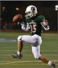  ??  ?? Portervill­e High School’s Eduardo Ramos dances with a ball after intercepti­ng a pass Friday at the end of the Granite Bowl against Monache High School at Jacob Rankin Stadium in Portervill­e.