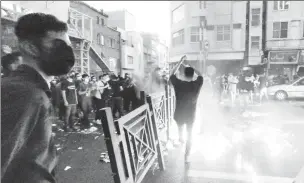  ?? Photo: WANA (West Asia News Agency) via REUTERS ?? People light a fire during a protest over the death of Mahsa Amini, a woman who died after being arrested by the Islamic republic’s “morality police”, in Tehran, Iran September 21, 2022.