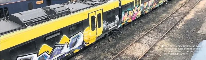  ??  ?? The new Merseyrail trains have been covered with graffiti before they have arrived in our region (Pic: Nicholas Garner)