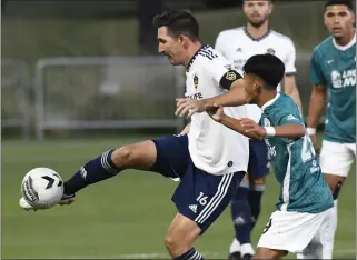  ?? PHOTO BY PAUL RODRIGUEZ ?? The Galaxy’s Sacha Kljestan, left, gets in front of California United Strikers FC’S Marcus Lee to control the ball during Wednesday night’s U.S. Open Cup victory in Irvine. The Galaxy advanced to the Round of 16.
Galaxy vs. Dallas, Saturday, 7:30p.m., ESPN+, Specsn