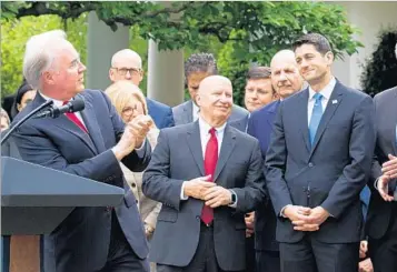  ?? CHERISS MAY/SIPA USA ?? Tom Price, secretary of Health and Human Services, applauds GOP members, including House Speaker Paul Ryan, right, on May 4 after passage of a House bill to repeal Obamacare.