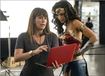  ?? CLAY ENOS — WARNER BROS. ENTERTAINM­ENT ?? Director Patty Jenkins, left, with actress Gal Gadot on the set of “Wonder Woman 1984.”