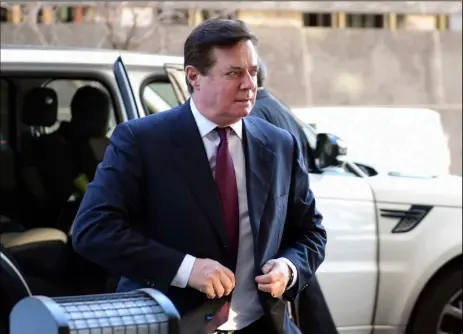  ?? AP PHOTO ?? In this Dec. 11 file photo, former Trump campaign chairman Paul Manafort arrives at federal court in Washington. In a dramatic escalation of pressure and stakes, special counsel Robert Mueller filed additional criminal charges Feb. 22 against Manafort...