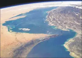  ?? NASA ?? THE STRAIT OF HORMUZ, shown in an image from the Internatio­nal Space Station, is the busiest and most crucial waterway for the world’s oil industry.