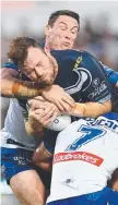  ?? Gavin Cooper gets tackled. ??