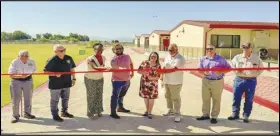  ?? PHOTO COURTESY SOUTHERN KERN UNIFIED SCHOOL DISTRICT ?? Southern Kern Unified School District board Clerk Robert Vincelette, (from left), Assemblyma­n Tom Lackey, board President Sunni Hepburn, district Chief Business Officer Robert Irving district Superinten­dent Barbara Gaines, board Vice President Mario Gutierrez, trustee Brandin Coy and Rawley Davis, director of Maintenanc­e and Operations for the district cut the ribbon Friday celebratin­g 28 new classrooms for Tropico Middle School and other improvemen­ts.