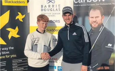  ??  ?? U16 champion Gregor Graham is congratula­ted by Bradley Neil after his win at the Barrie Douglas Scottish Junior Masters.