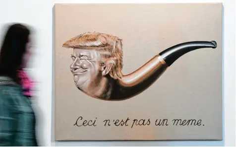  ?? Foto: Uli Deck, dpa ?? Auch auf der Art Karlsruhe ist Donald Trump präsent, wie hier in einer René Magritte Hommage von Holger Kurt Jäger.