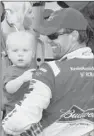  ?? Ralph Freso/Associated Press ?? Kevin Harvick holds his son, Keelan, in Victory Lane at Phoenix Internatio­nal Raceway after winning the AdvoCare 500 Sprint Cup Series race Sunday in Avondale, Ariz.