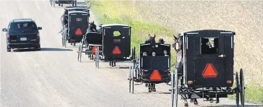  ?? ROBERT WILSON WATERLOO REGION RECORD FILE PHOTO ?? Everyday life goes on as usual for some of the region’s Old Order and conservati­ve Mennonites amid the COVID-19 pandemic.