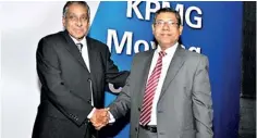  ??  ?? Nirmal Fernando (Left), senior partner KPMG Ford, Rhodes, Thornton and Company, congratula­ting Reyaz Mihular, Managing Partner, KPMG Sri Lanka on his appointmen­t to the post of Managing Partner. (Pic by Pradeep Pathirana)