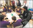  ?? David Borges / Hearst Connecticu­t Media ?? UConn junior Isaiah Whaley interacts with Naylor Elementary School students on Monday morning.