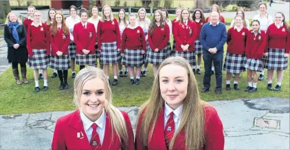  ?? PHOTO: JONO EDWARDS ?? No minor feat . . . Dunstan High School Senior Girls’ Choir leaders Dana Jenkins (18, left) and Holly Taucher (18) are hoping their efforts do not fall flat at the national Big Sing competitio­n in Auckland in August.