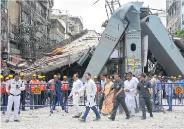  ??  ?? INSPECTING THE DAMAGE: Rahul Gandhi, centre left, vice president of the All India Congress Committee, and Adhir Ranjan Chowdhury, to his right, state president for West Bengal Pradesh Congress Committee, visit the site of a collapsed flyover in Kolkata.