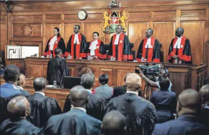  ??  ?? Landmark ruling: Last week, Kenya’s supreme court judges declared President Uhuru Kenyatta’s election win invalid. The verdict has thrown internatio­nal observer missions into sharp focus. Photo: Baz Ratner/Reuters