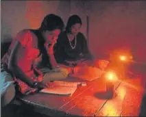  ?? HT PHOTO ?? Students in these 20 villages struggle to study under kerosene lamps as repeated promises of electrific­ation have not been fulfilled.