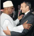  ?? Picture: AFP ?? FLYING VISIT: Mali’s President Ibrahim Boubacar Keita, left, welcomes French President Emmanuel Macron