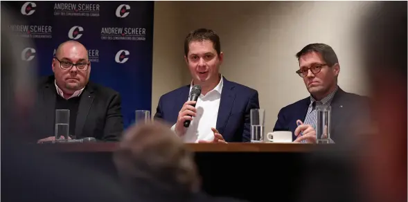  ?? CITIZEN PHOTO BY BRENT BRAATEN ?? Conservati­ve leader Andrew Scheer speaks at a business town hall meeting on Monday, flanked by local MPs Todd Doherty and Bob Zimmer.