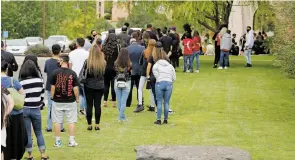  ?? PHOTOS BY LUIS SÁNCHEZ SATURNO/THE NEW MEXICAN ?? People wait outside The Light at Mission Viejo for Fedonta ‘JB’ White’s funeral service Wednesday.