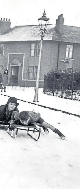  ??  ?? WINTER SPORTS: Dundee youngsters take advantage of the snow in 1947 to go sledging.