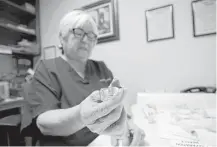  ?? Godofredo A. Vasquez / Houston Chronicle ?? Texas Clinic nurse and drug counselor Gloria Rodriguez prepares a Vivitrol injection for a patient on Wednesday.