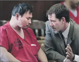  ?? Paul Sakuma Associated Press ?? ONE L. GOH, left, listens to his attorney, David Klaus, in an Oakland courtroom in 2012. Goh, 48, faces seven terms of life in prison for a mass shooting that year.