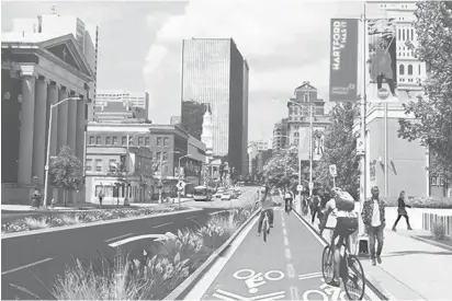  ?? CITY OF HARTFORD ?? A two-way bicycle path runs on one side of Main Street in front of the federal courthouse in downtown Hartford in this rendering by Stantec, the project consultant for the Re-Imagining Main Street project.
