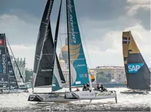  ?? – Supplied photo ?? BLISTERING PERFORMANC­E: Oman Air foiling catamaran, skippered by Morgan Larson, in action at the 2016 Extreme Sailing Series Act 5 in St Petersburg.