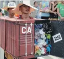 ?? AARON FAVILA THE ASSOCIATED PRESS ?? Filipino environmen­tal activists protest with a mock container van filled with garbage outside the Canadian embassy south of Manila in 2015.