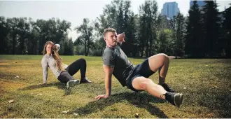  ?? LEAH HENNEL ?? Above, trainer Cait Grant, left and Beau Petersen work out at Prince’s Island Park.