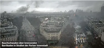  ??  ?? Rauchschwa­den über brennenden Barrikaden in Straßen der Pariser Innenstadt
