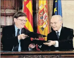  ?? MANUEL BRUQUE / EFE ?? El presidente valenciano, Ximo Puig, junto a Isidro Fainé