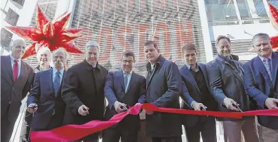  ?? STAFF PHOTO BY ANGELA ROWLINGS ?? RETAIL DETAIL: Boston city officials joined executives from WS Developmen­t for a ribbon cutting of One Seaport, a 1.5 million-square-foot, mixed-use project on the waterfront.