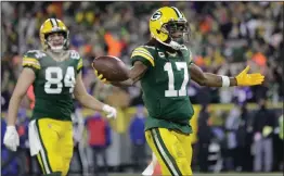  ?? AP PHOTO AARON GASH ?? Green Bay Packers’ Davante Adams reacts after catching a touchdown pass during the first half of an NFL football game against the Minnesota Vikings Sunday, Jan. 2, 2022, in Green Bay, Wis.